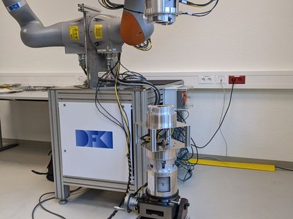 Mechanical test setup of the SIROM from SENER Aeroespacial S.A. with a fixed payload module attached to the rotation and tilt table 